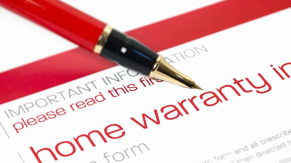 home warranty contract with red pen