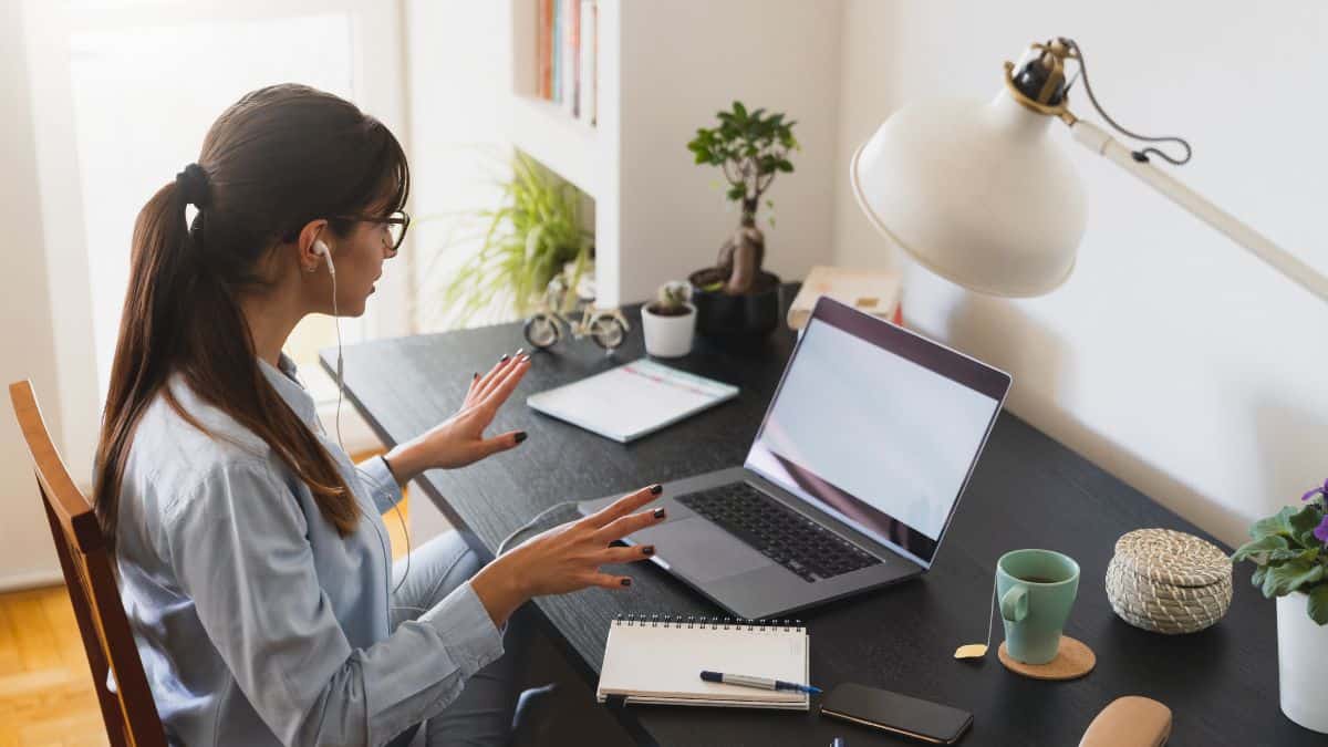 woman working from home with laptop desk